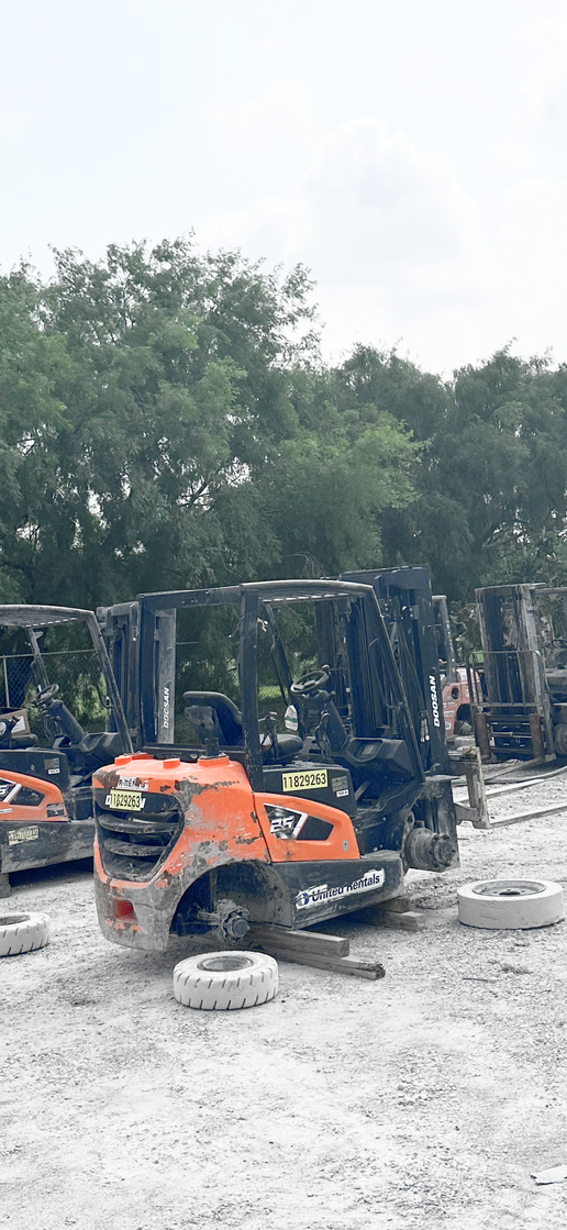 Damaged forklift sitting in the yard before rebuild