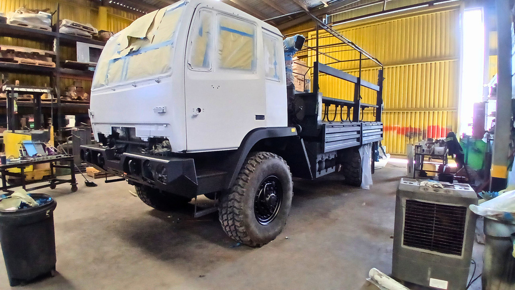 Truck masked and primed inside the shop before painting